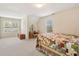 Bright bedroom with a sloped ceiling, featuring two windows and charming antique furnishings at 105 Pine Valley Ct, Hiram, GA 30141