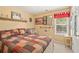 Cozy bedroom with decorative touches, featuring a large window and comfortable furnishings at 105 Pine Valley Ct, Hiram, GA 30141