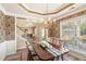 Traditional dining room with decorative wall paper, chandelier, and large window at 105 Pine Valley Ct, Hiram, GA 30141