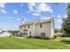Rear view of home showcasing a well-manicured lawn, mature trees, and a peaceful outdoor environment at 105 Pine Valley Ct, Hiram, GA 30141