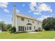 Back of home with a well-maintained lawn, a patio, and mature landscaping, creating a serene outdoor space at 105 Pine Valley Ct, Hiram, GA 30141