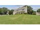Traditional two-story home with a welcoming front porch, lush landscaping, and a well-manicured lawn at 105 Pine Valley Ct, Hiram, GA 30141