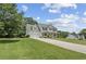 Spacious home features an attached two-car garage and long driveway at 105 Pine Valley Ct, Hiram, GA 30141