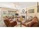 Cozy living room featuring a fireplace, ceiling fan, and comfortable seating at 105 Pine Valley Ct, Hiram, GA 30141