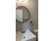 Cozy bathroom featuring modern fixtures, round mirror and ample lighting at 15 Harlan Rd, Atlanta, GA 30311