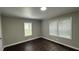 Bright bedroom with hardwood-look flooring and multiple windows at 15 Harlan Rd, Atlanta, GA 30311