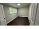 Bright bedroom featuring natural light, complemented by dark wood-look flooring at 15 Harlan Rd, Atlanta, GA 30311