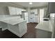 Bright kitchen with white cabinets, subway tile backsplash, and a quartz countertop at 15 Harlan Rd, Atlanta, GA 30311