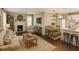 Inviting living room with wood floors, fireplace, ample seating, and modern decor accents at 15 Harlan Rd, Atlanta, GA 30311