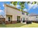 Back exterior showing a brick and siding home with a grassy yard and patio at 316 Sierra Ct, Mcdonough, GA 30253
