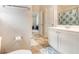Bathroom featuring a single sink vanity, with a toilet, and shower/tub combo in view at 316 Sierra Ct, Mcdonough, GA 30253