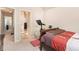 Bedroom featuring neutral walls, carpet flooring, with an ensuite bathroom and closet entrances at 316 Sierra Ct, Mcdonough, GA 30253