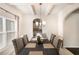 Elegant dining room with a chandelier, arched doorways, and neutral walls at 316 Sierra Ct, Mcdonough, GA 30253