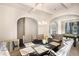 Elegant dining room with a chandelier, arched doorways, and a nearby billiards table at 316 Sierra Ct, Mcdonough, GA 30253