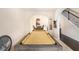 Relaxing game room with a billiard table, arched doorways, and a nearby staircase at 316 Sierra Ct, Mcdonough, GA 30253