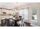 Eat-in kitchen features stainless appliances, granite counters, dark hardwoods and an exterior access door at 316 Sierra Ct, Mcdonough, GA 30253