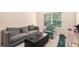 Cozy living room with neutral tones, plush seating and natural light from a nearby window at 316 Sierra Ct, Mcdonough, GA 30253