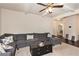 Comfortable living room featuring plush seating, a dark wood coffee table, and neutral walls at 316 Sierra Ct, Mcdonough, GA 30253