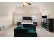 Inviting primary bedroom features dark furniture, vaulted ceiling, fan, and bright windows at 316 Sierra Ct, Mcdonough, GA 30253