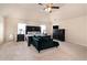 Comfortable primary bedroom with high ceiling, dark furniture, and bright windows at 316 Sierra Ct, Mcdonough, GA 30253