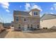 Exterior view of a brick home with a concrete patio and spacious backyard with sky at 619 Leafy Branch Way, Mcdonough, GA 30253
