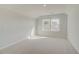 Spacious bedroom with vaulted ceiling and large windows bringing in natural light at 619 Leafy Branch Way, Mcdonough, GA 30253