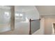 Upstairs bonus room features an abundance of natural light and plush carpeting at 619 Leafy Branch Way, Mcdonough, GA 30253