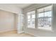 Bright office with hardwood floors, french doors and a large window overlooking front yard at 619 Leafy Branch Way, Mcdonough, GA 30253
