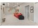 Versatile basement space with carpet, red couch, and ample room for entertainment or relaxation at 154 Hunters Trl, Dallas, GA 30157