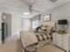Comfortable bedroom featuring soft lighting, neutral tones, and a tufted headboard, ideal for restful nights at 154 Hunters Trl, Dallas, GA 30157