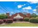 Welcoming brick entrance to Hunter's Glen with manicured landscaping at 154 Hunters Trl, Dallas, GA 30157