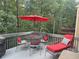Outdoor deck space with a table, chairs, umbrella, and chaise lounge perfect for relaxing at 154 Hunters Trl, Dallas, GA 30157