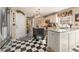 Modern kitchen with stainless steel appliances, a center island, and checkerboard floors at 154 Hunters Trl, Dallas, GA 30157