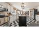 Spacious kitchen featuring white cabinets, granite countertops, and checkerboard flooring at 154 Hunters Trl, Dallas, GA 30157