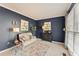 Cozy living room with blue walls, comfortable seating, and natural light at 154 Hunters Trl, Dallas, GA 30157