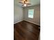 Bedroom with hardwood floors, a modern ceiling fan, and lots of natural light at 38 Royce Dr, Jonesboro, GA 30238