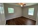 Bedroom with hardwood floors, a modern ceiling fan, and lots of natural light at 38 Royce Dr, Jonesboro, GA 30238