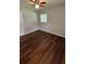 Bedroom with hardwood floors, a modern ceiling fan, and lots of natural light at 38 Royce Dr, Jonesboro, GA 30238