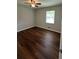 Bedroom with hardwood floors, a modern ceiling fan, and lots of natural light at 38 Royce Dr, Jonesboro, GA 30238