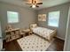 Bright bedroom with hardwood floors, a ceiling fan, and lots of natural light at 38 Royce Dr, Jonesboro, GA 30238