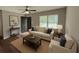 Inviting living room with hardwood floors, a comfortable sofa, and plenty of natural light at 38 Royce Dr, Jonesboro, GA 30238