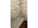 Modern shower with neutral tile and glass accents at 38 Royce Dr, Jonesboro, GA 30238