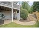 Landscaped backyard featuring a flagstone patio with a dining set, and an abundance of mature shrubbery at 4320 Cody Ct, Cumming, GA 30040