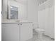 Clean bathroom with a white vanity, sink, toilet, and shower with tub at 4320 Cody Ct, Cumming, GA 30040