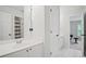 Modern bathroom with a single sink vanity and an adjacent room view at 4320 Cody Ct, Cumming, GA 30040