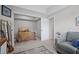 Bedroom with a comfortable grey couch and a guitar leaning against the wall at 4320 Cody Ct, Cumming, GA 30040