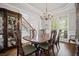 Elegant dining room features a classic chandelier, wood table, and detailed crown molding at 4320 Cody Ct, Cumming, GA 30040