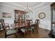 Elegant dining room with hardwood floors, traditional furnishings, and stylish lighting at 4320 Cody Ct, Cumming, GA 30040