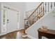 Elegant foyer featuring hardwood floors, staircase with iron balusters, and neutral paint at 4320 Cody Ct, Cumming, GA 30040