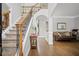 Elegant foyer featuring hardwood floors, staircase with iron balusters, and neutral paint at 4320 Cody Ct, Cumming, GA 30040